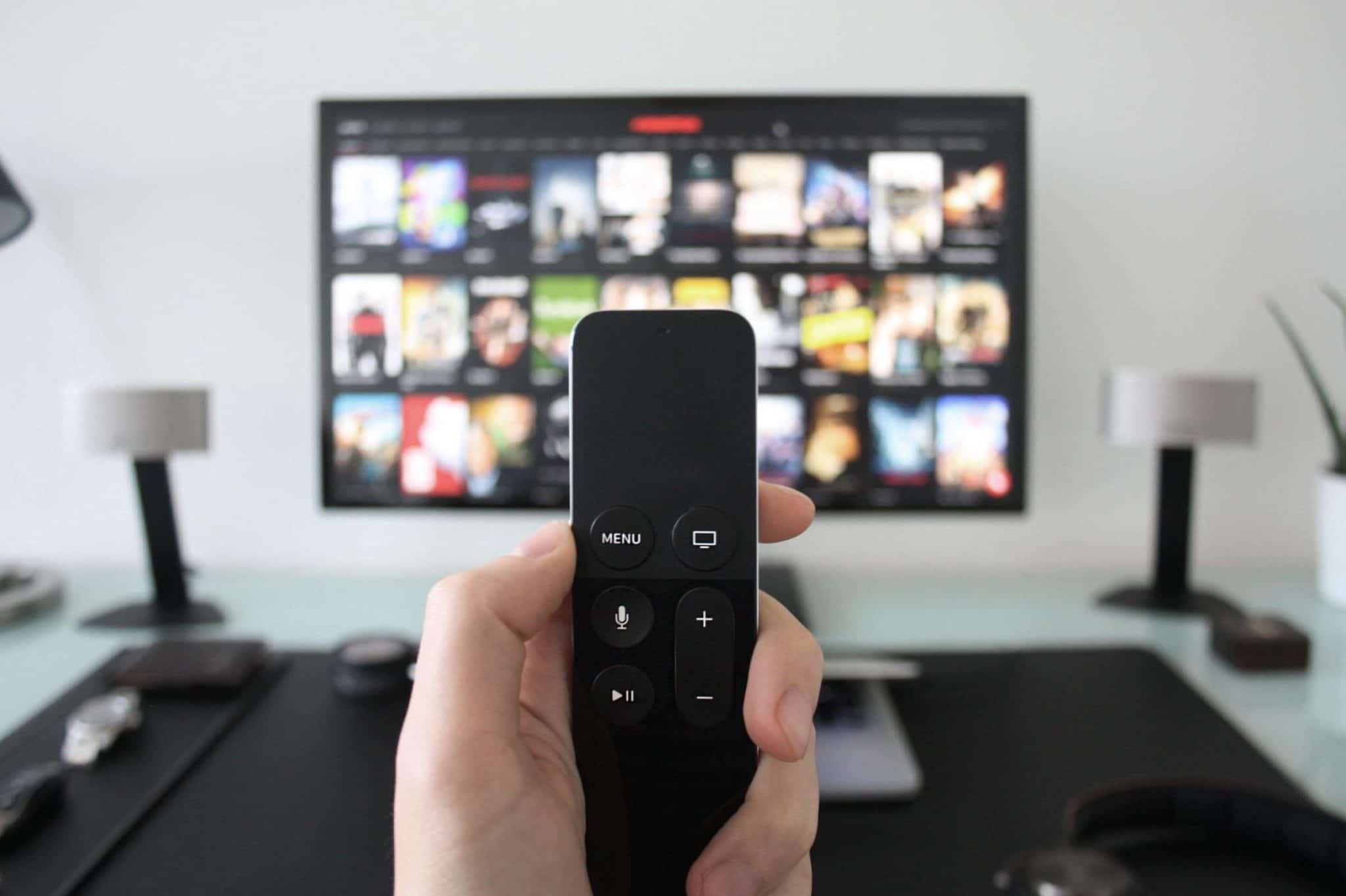 Tv remote in front of tv
