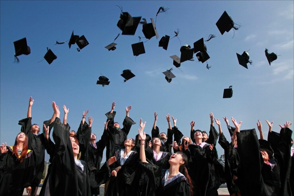 Graduates tossing their caps in the air