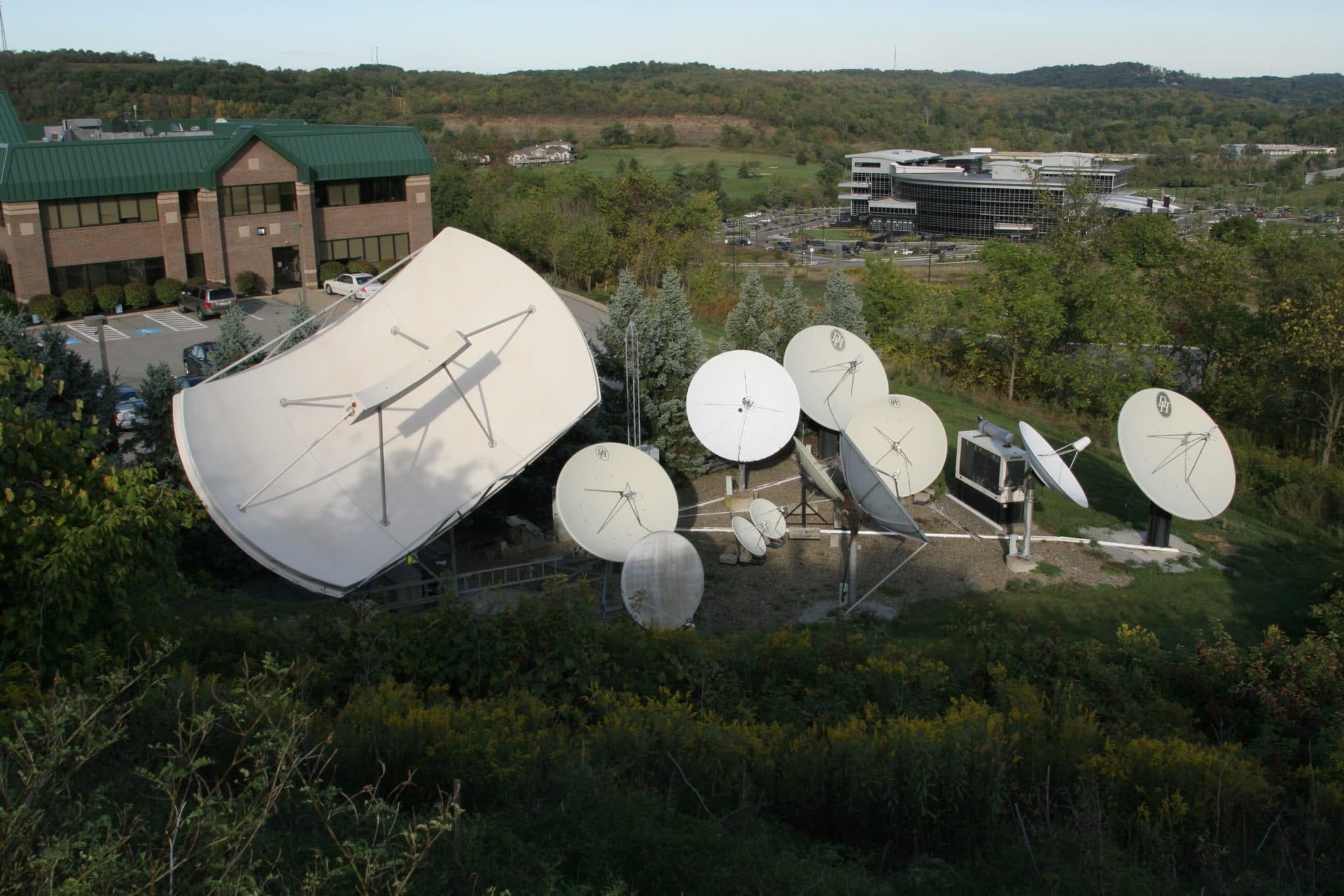 Overhead image of VITAC office building, complete with satellite dishes in the foreground for our 34 birthday