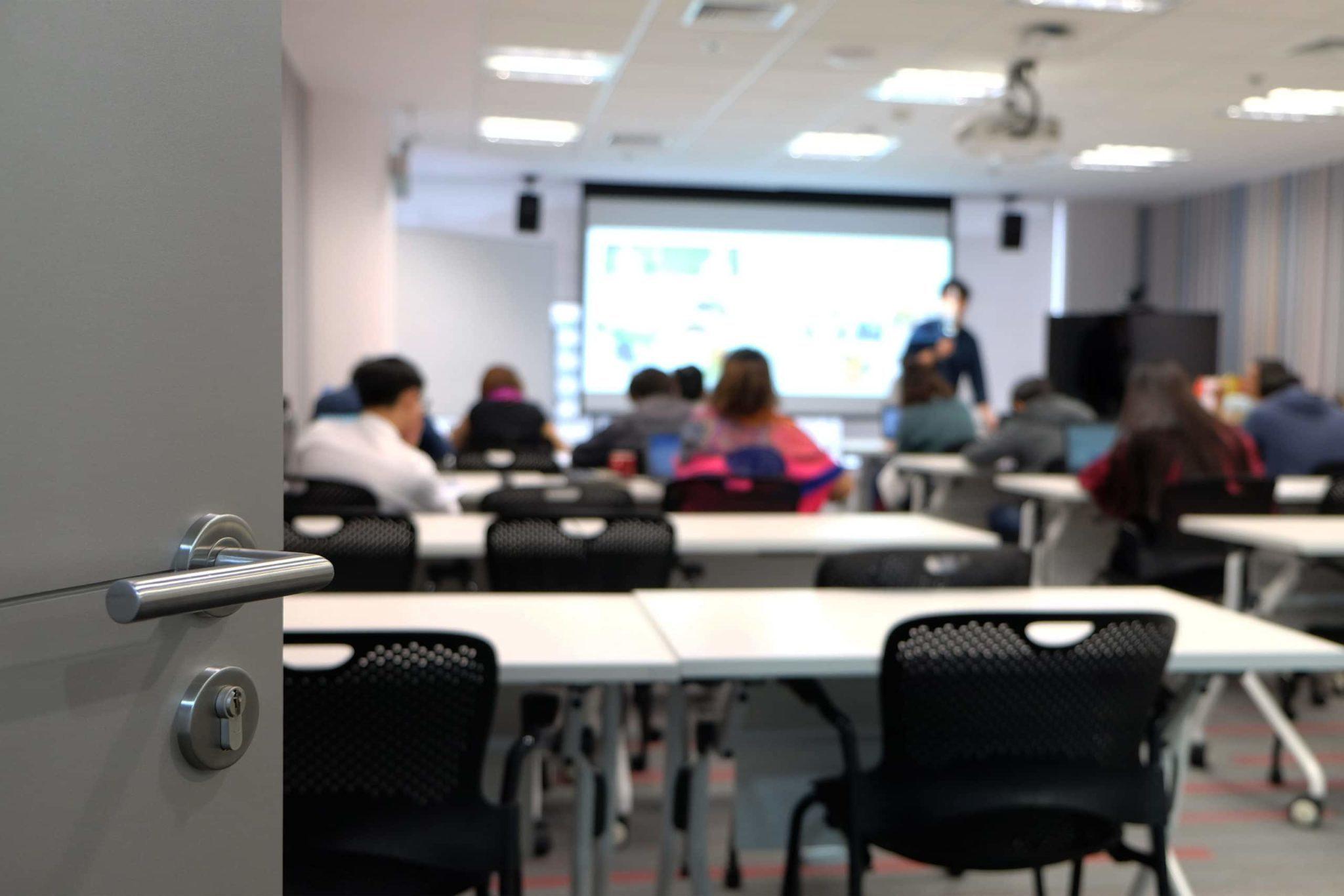 Blurred image of students in a classroom
