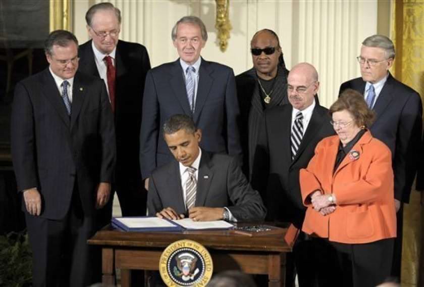 President Obama signing the CVAA in 2010