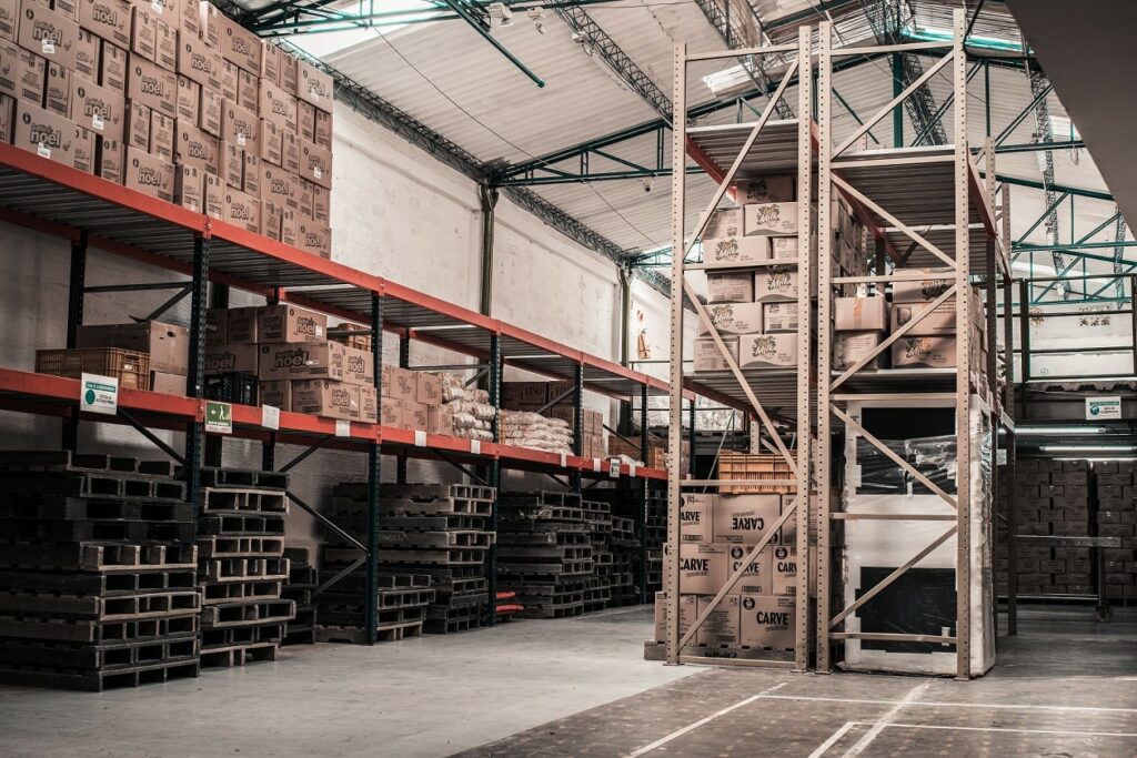 Interior of a warehouse with boxes and shelving for the ADA blog