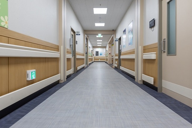 A long shot of an interior hallway at a hospital for the ADA Blog