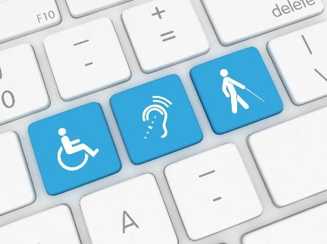 Computer keyboard with individual keys noting accessibility - wheelchair access, deafness, and blindness