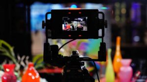 Looking through a camera's viewfinder at the NAB floor show