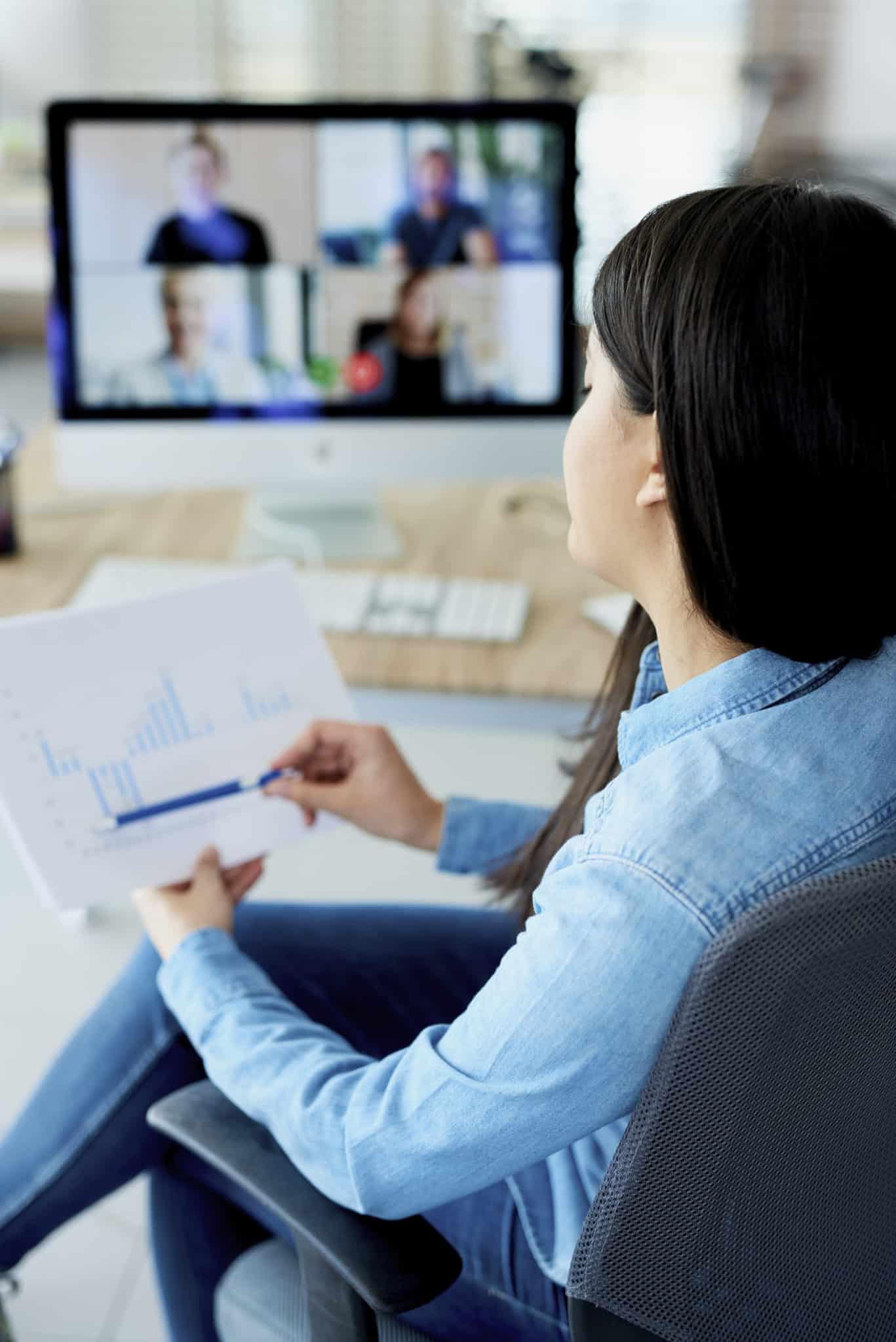 Vertical photography of woman having video conference