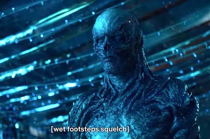 Vecna, humanoid monster with black skin and movable vines that protrude from his entire body, stares offscreen while the captions read "wet footsteps squelch."