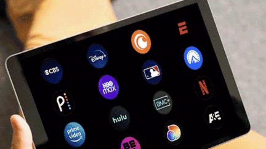 person choosing streaming services on tablet