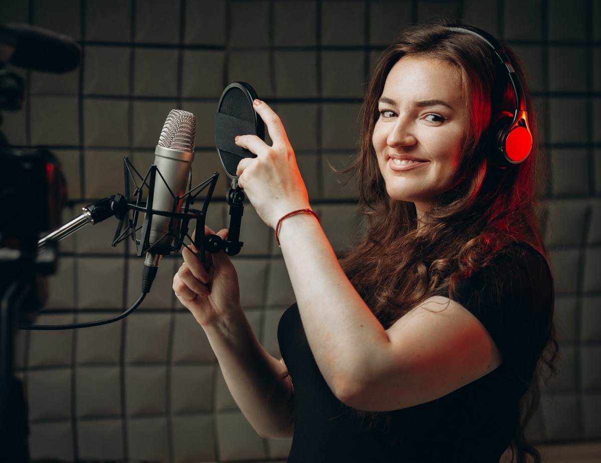 woman with headphones and microphone