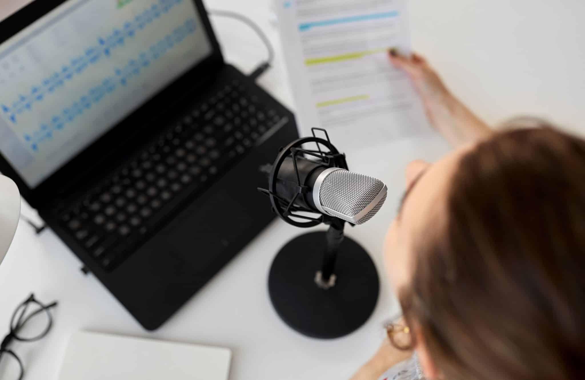 woman-on-computer-speaking-into-microphone