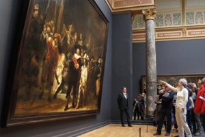 visitors at the Rijksmuseum admiring paintings from the Dutch Golden Age