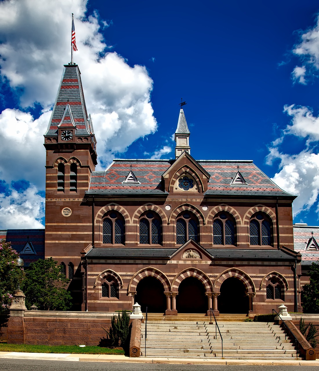 Image of Gallaudet University's iconic Chapel Hall - a red brick and stone building with arches and a clock tower.