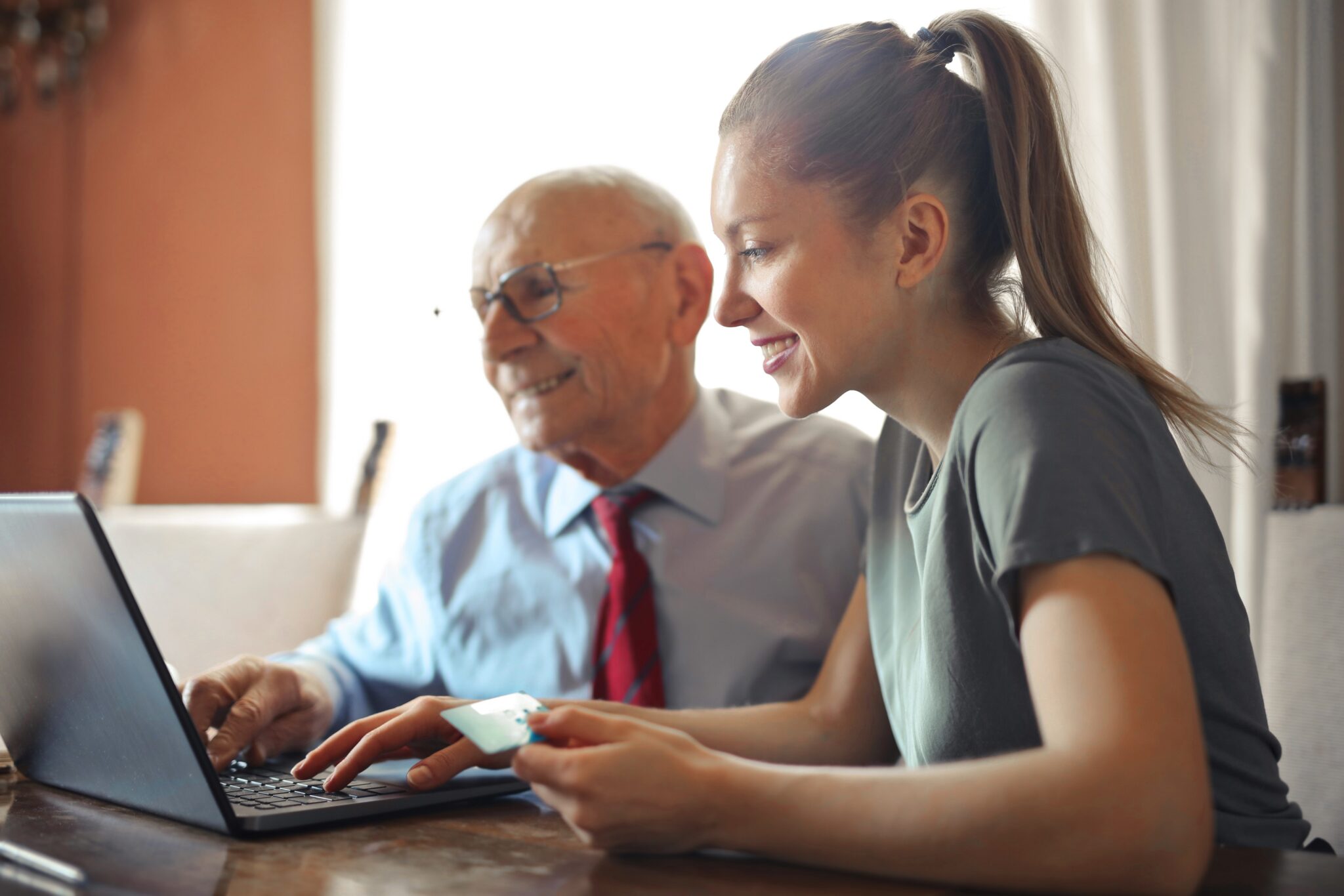 An older man and a younger women sitting at a desk looking over a laptop computer for the CVTA blog