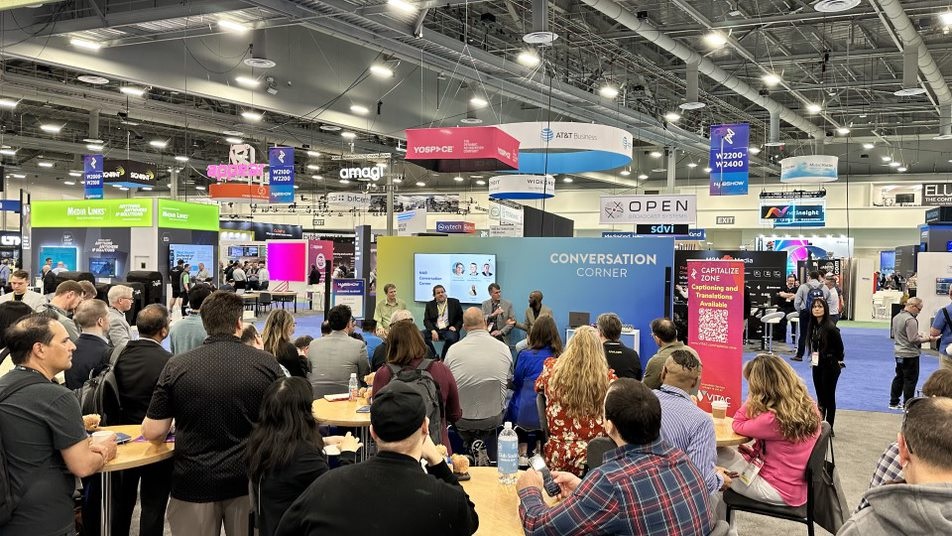 Wide shot of a crowd of people waiting to listen to VITAC's technology discussion at the 2024 NAB Show